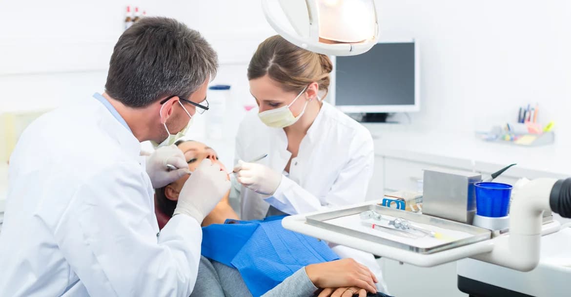 Dentist treating patient at Tooth and Gums Greater Noida