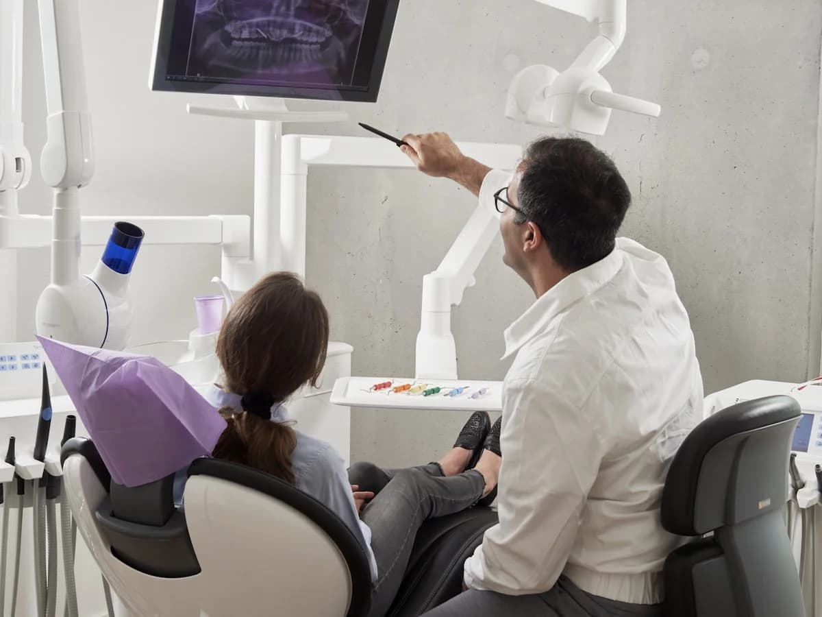 Dentist treating a patient at Tooth and Gums in Greater Noida