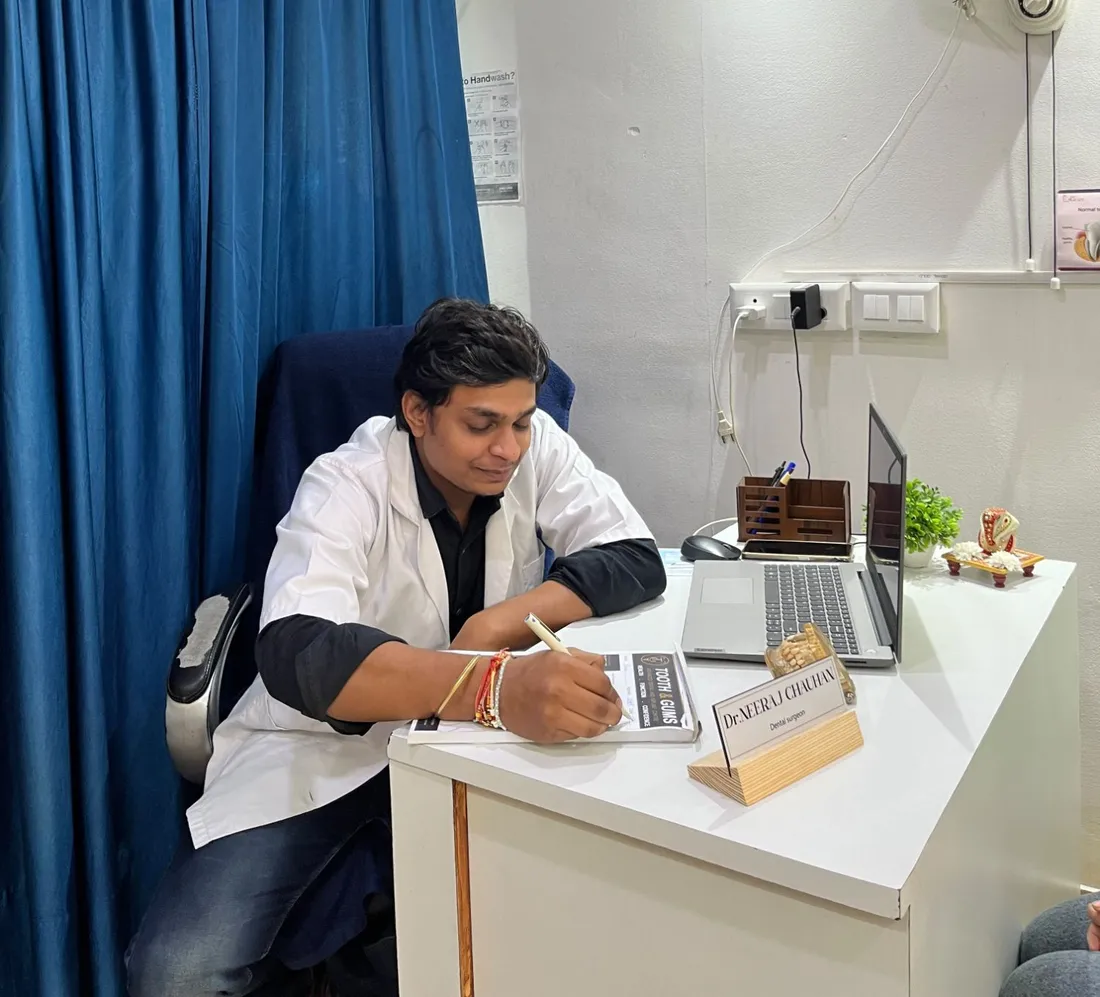 Dr. Neeraj Chauhan at his desk in the Tooth and Gums clinic, Greater Noida